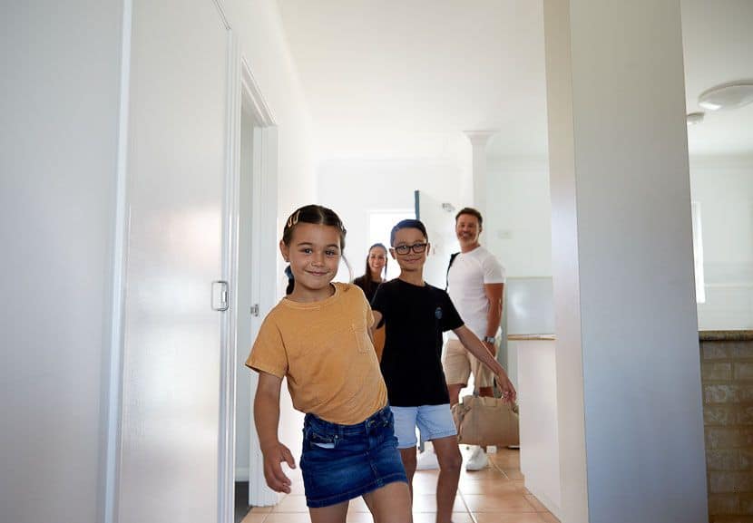A family enters their room at the resort.