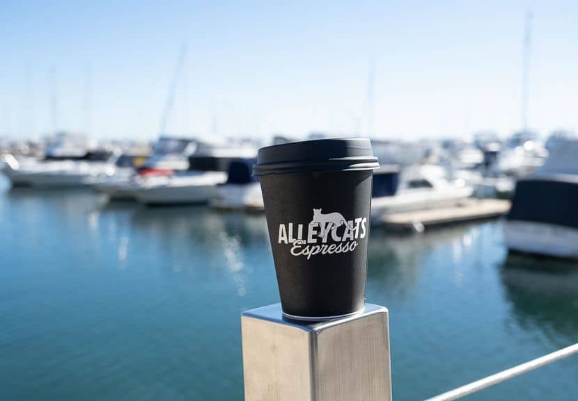 A coffee in a takeaway cup from Alleycat Espresso.